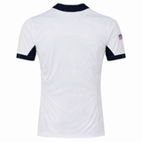 The USA Rugby 24/25 Pro Away Jersey by Castore is a white short-sleeve jersey with navy collar and sleeve accents, viewed from the back, featuring a small American flag on the right sleeve—ideal for USA Rugby fans.