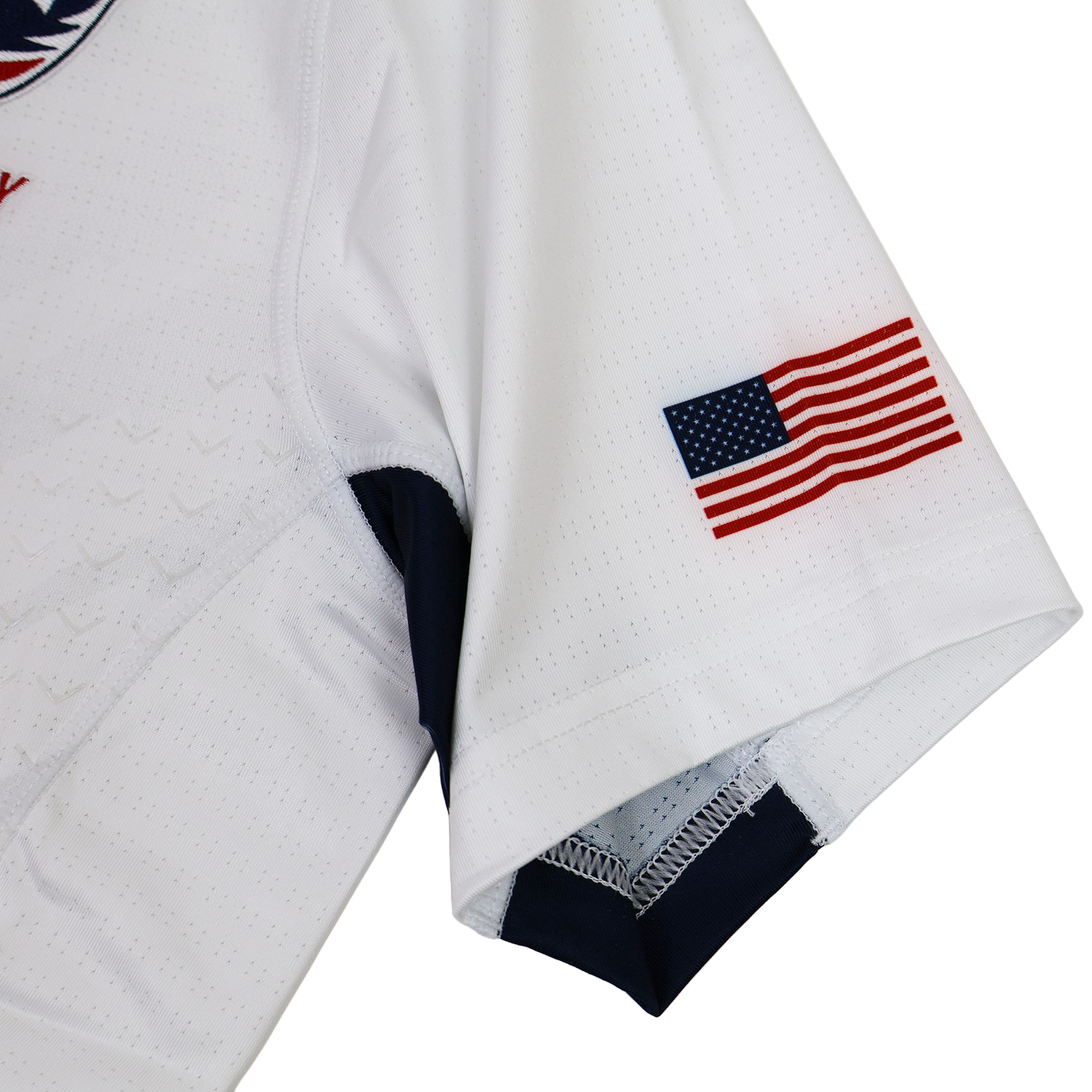 A close-up of the USA Rugby 24/25 Pro 7s Away Jersey sleeve by Castore, showing a small American flag patch near the hem.