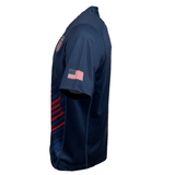 Side view of the Castore USA Rugby 24/25 Olympic 7's Jersey: navy blue, short sleeves, with a small American flag patch on the sleeve and a USA crest on the chest—essential gear for Eagles fans.