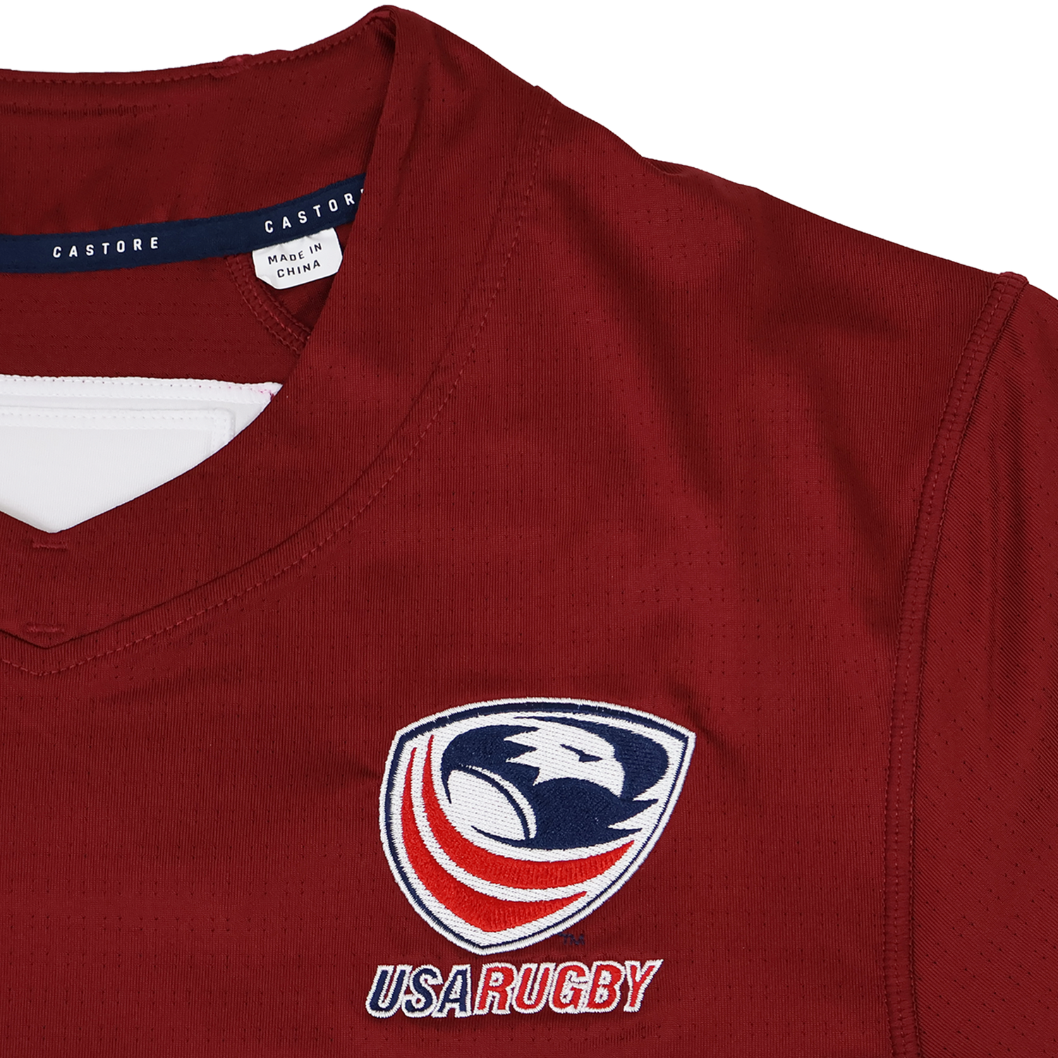 The USA Rugby 24/25 Pro Training Jersey by Castore is a maroon jersey with a "USA Rugby" logo and eagle emblem on the chest.