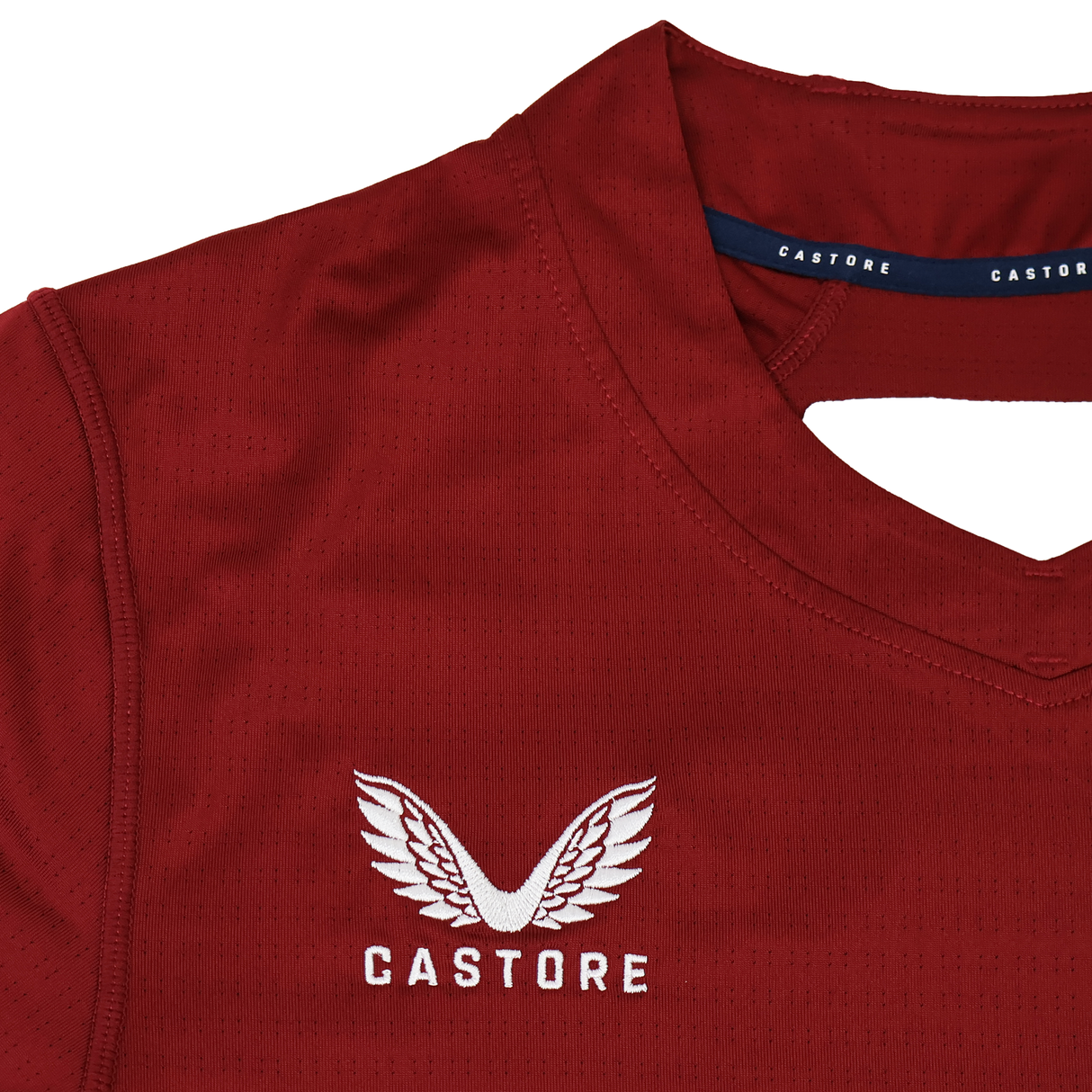 A close-up of the USA Rugby 24/25 Pro Training Jersey by Castore shows the white winged Castore logo and brand name on the chest, specially designed for USA Rugby athletes.