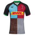 The Harlequins 24/25 Pro Home Jersey by Castore features multi-color panels with black sleeves, bold geometric patterns, a DHL chest logo, and the Harlequins crest on the left—official 2024/25 home kit.