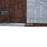 Close-up of the Harlequins 24/25 Pro Home Jersey by Castore fabric, featuring a "CASTORE" label with code, patterned design, and "NUNQUAM DORMIO 1866" text printed near the hem.