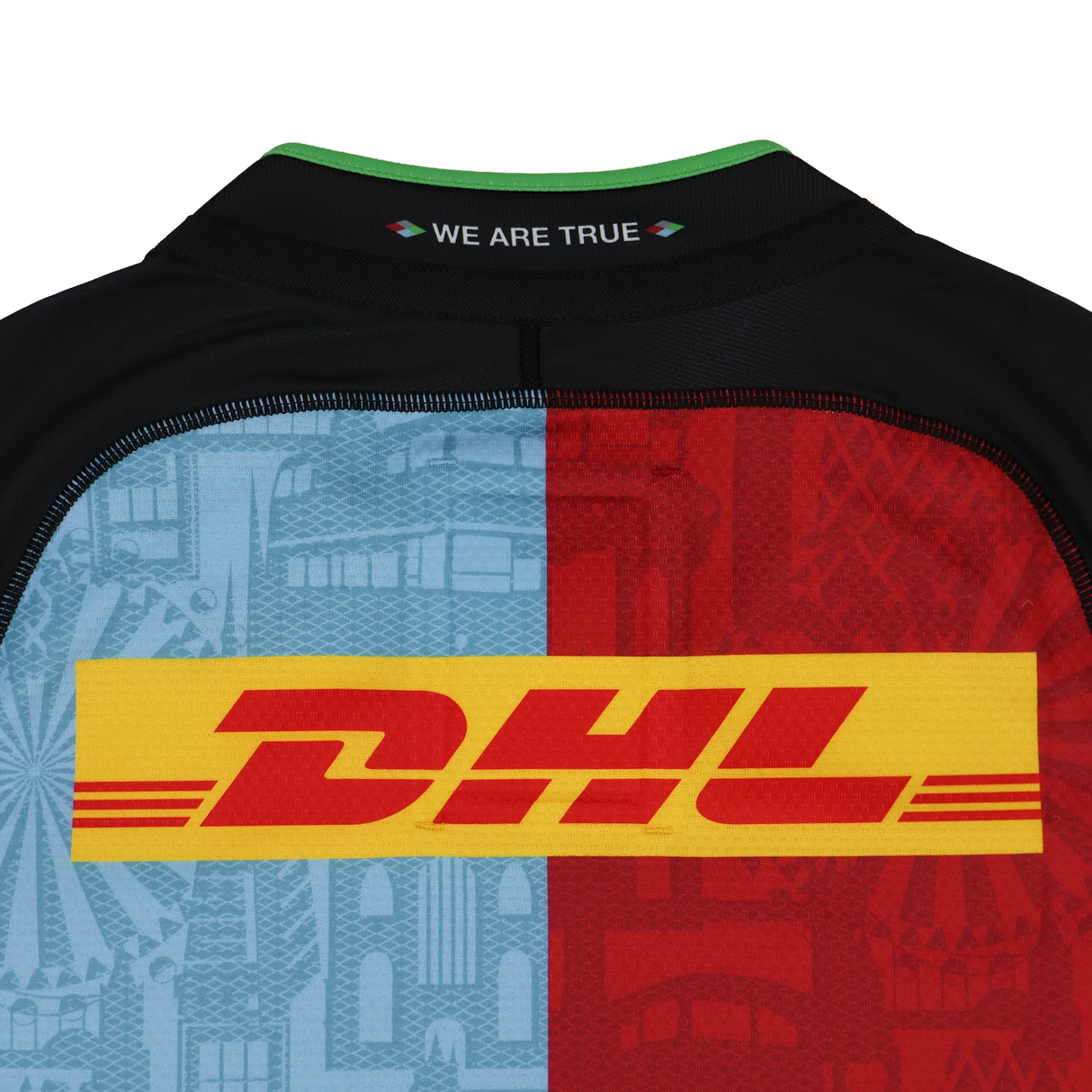 Back of the Harlequins 24/25 Pro Home Jersey by Castore, featuring a DHL logo, split light blue and red halves with cityscape designs, and "WE ARE TRUE" below the collar—a striking Castore rugby shirt.