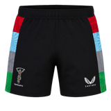 The Harlequins 24/25 Pro Home Short by Castore features black fabric with colorful side panels and official Harlequins and Castore logos—ideal for fans wanting authentic rugby teamwear.