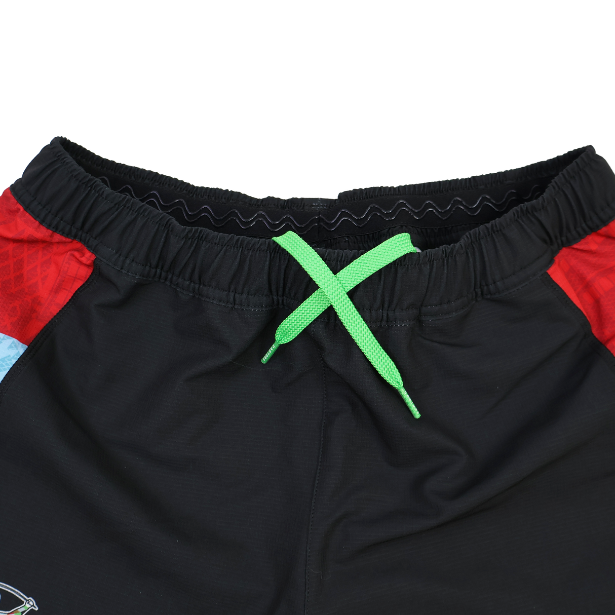 Close-up of the waistband on Castore's Harlequins 24/25 Pro Home Short, black rugby shorts with a green drawstring and red side panels, designed for professional teamwear.