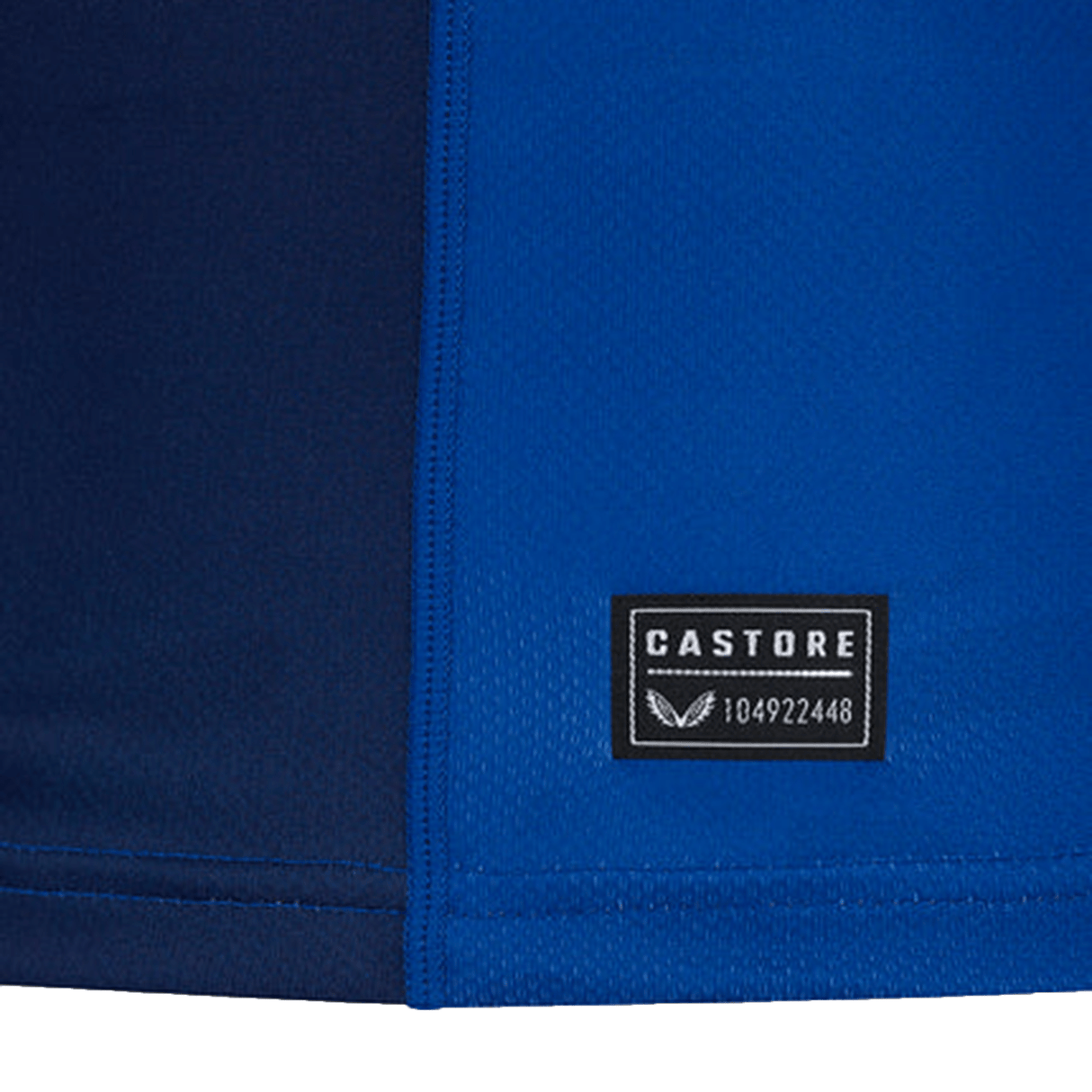 Close-up of the Leinster 24/25 Home Replica Jersey by Castore, in two-tone blue, showing a rectangular black Castore label with "CASTORE" and a serial number.