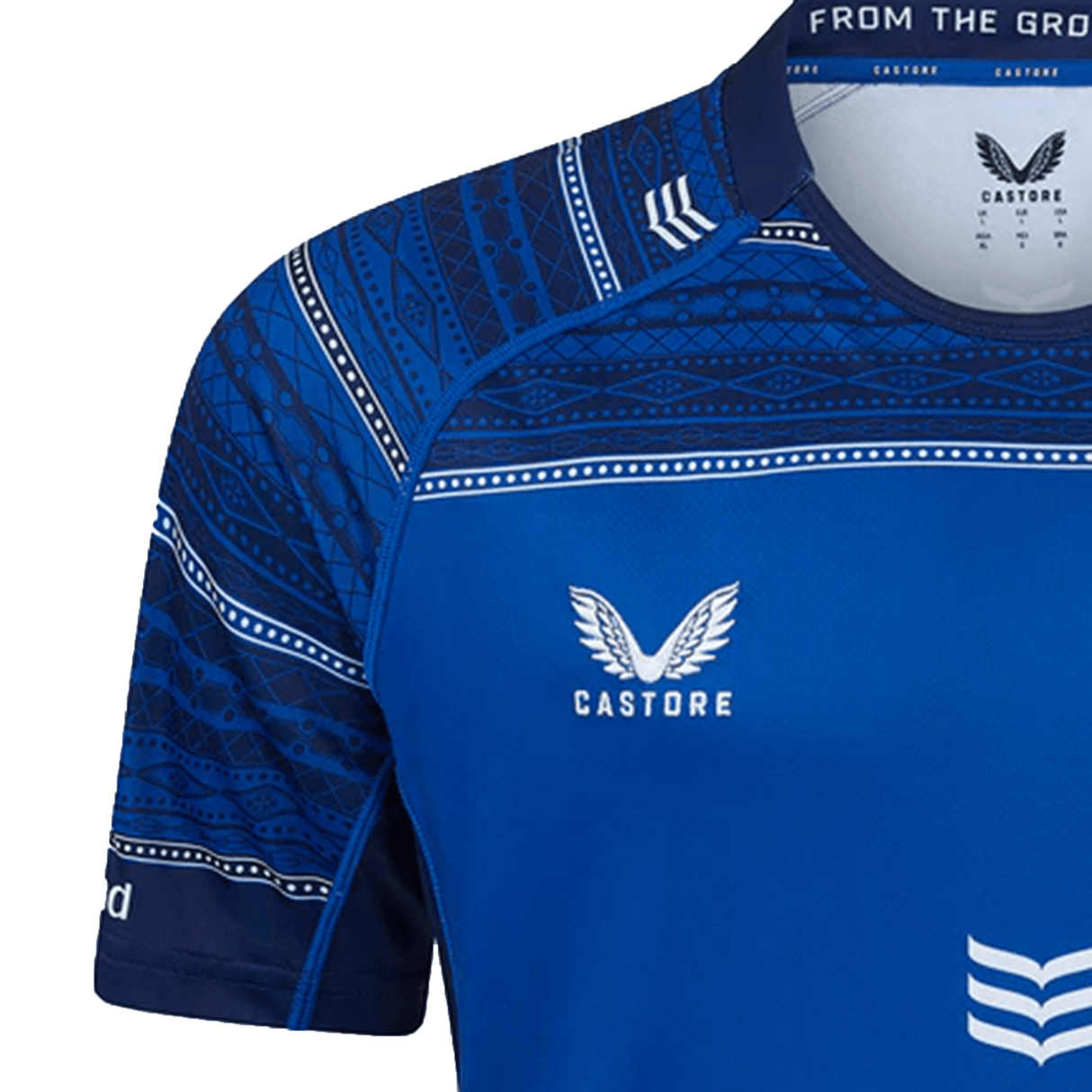 The Leinster 24/25 Home Replica Jersey by Castore features a blue design with patterned sleeves, geometric details on the shoulders and collar, plus Castore branding—a standout home jersey for Leinster fans.