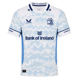 The Castore Leinster 24/25 Replica Away Jersey features a light blue and white zigzag design, sponsorship logos, and three stars above the club crest on the chest.