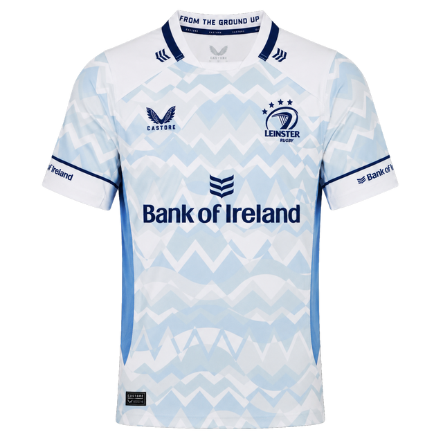 The Castore Leinster 24/25 Replica Away Jersey features a light blue and white zigzag design, sponsorship logos, and three stars above the club crest on the chest.