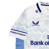 The Leinster 24/25 Replica Away Jersey by Castore features a striking light blue and white zigzag design, Bank of Ireland logos, and bold blue collar and sleeve accents—a must-have shirt for passionate Leinster Rugby fans.