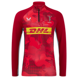 The Harlequins 24/25 Matchday 1/4 Zip Midlayer by Castore features red and maroon long sleeves, yellow DHL logo, Castore branding, and the Harlequins crest on the chest.
