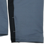 Close-up of gray and black pant legs with stitching and a side slit—ideal to pair with your Castore Bath 24/25 Pro Players 1/4 Zip Midlayer for a complete sporty look.