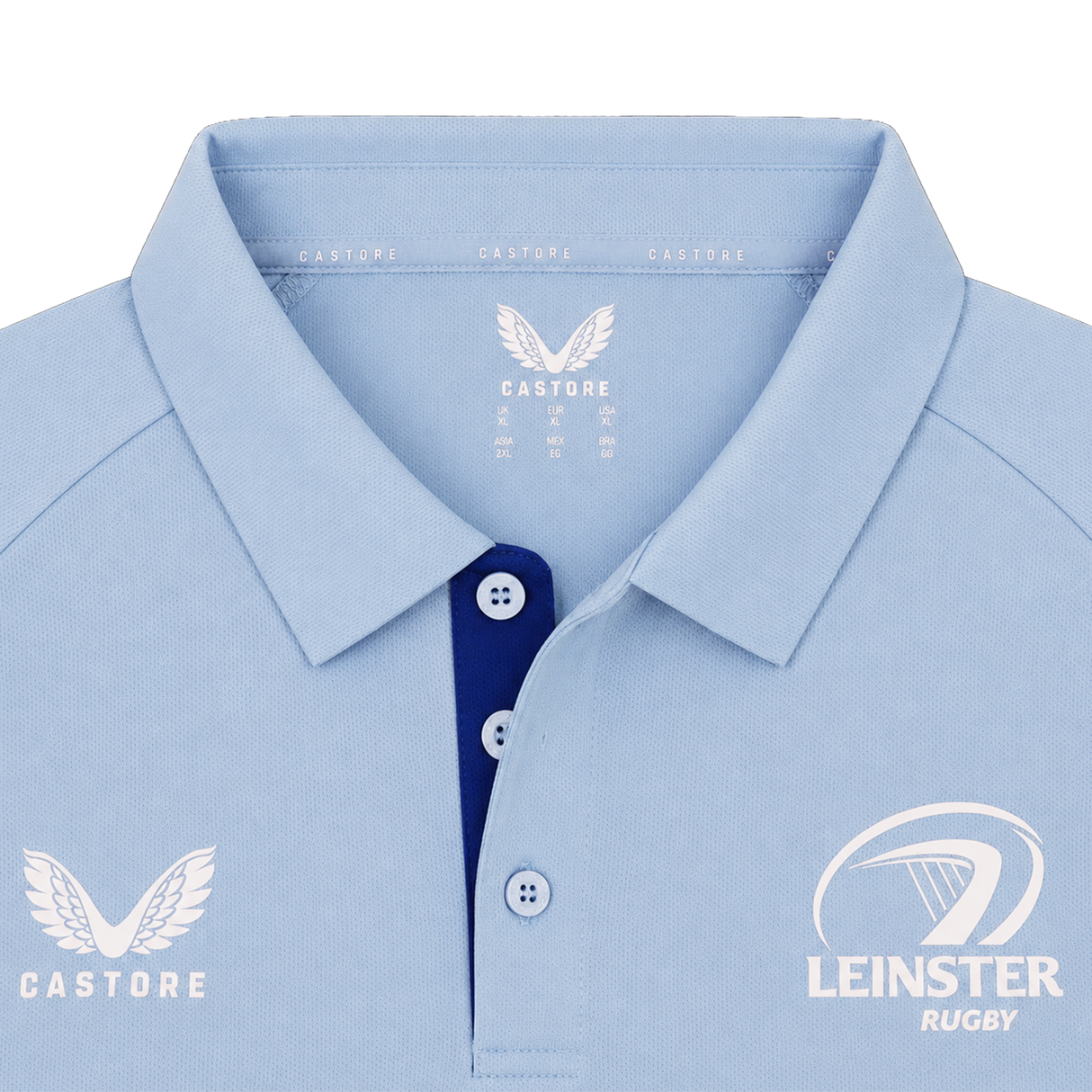 The Leinster 24/25 Pro Players Media Polo by Castore features a light blue design with a collar, Castore logo on the left chest, Leinster Rugby logo on the right chest, and contrasting blue buttons.