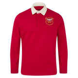 The Scarlets 24/25 Retro Rugby Jersey by Castore features classic long sleeves, a white collar, and a yellow "Scarlets 1872" crest on red, showcasing timeless rugby style.