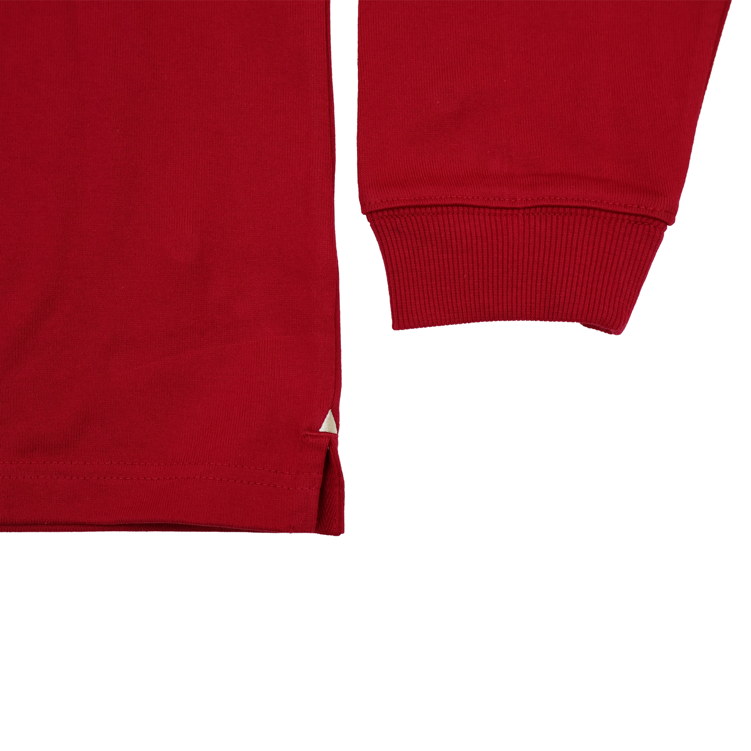 Close-up of the Scarlets 24/25 Retro Rugby Jersey by Castore, a red long-sleeve shirt inspired by classic rugby style, highlighting the cuff, lower hem with side slit, and set against a plain white background.