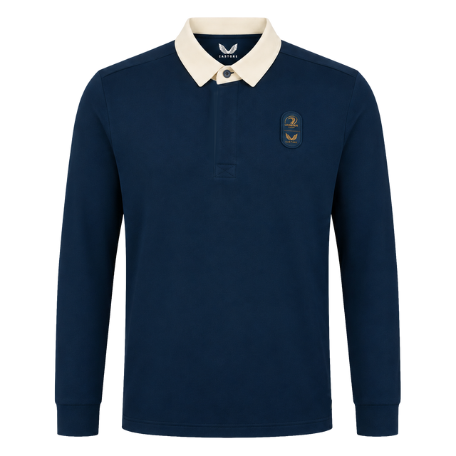 The Leinster 25/26 Dual Branded Jersey by Castore features long sleeves, a navy blue design with a white collar, and two embroidered left chest patches inspired by the classic Leinster Rugby jersey.