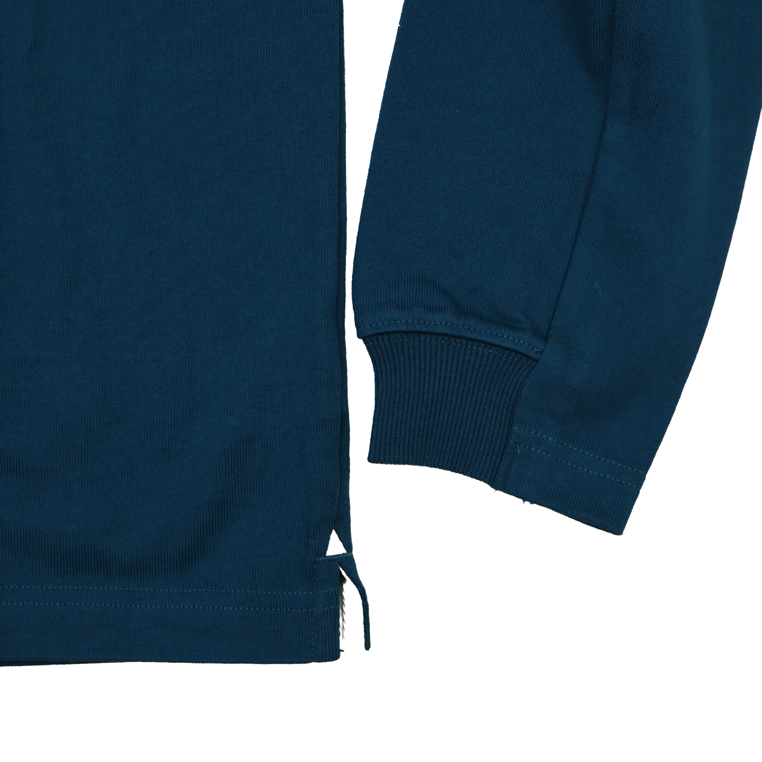 Close-up of the lower side and sleeve cuff of the Leinster 25/26 Dual Branded Jersey by Castore, showing ribbed fabric, a small side slit, and tie detail.