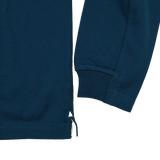 Close-up of the lower side and sleeve cuff of the Leinster 25/26 Dual Branded Jersey by Castore, showing ribbed fabric, a small side slit, and tie detail.
