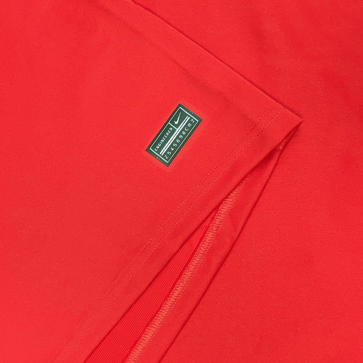 A close up of a Nike RC Toulon Home Rugby Jersey 23/24 with a logo on it.