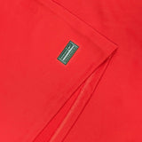 A close up of a Nike RC Toulon Home Rugby Jersey 23/24 with a logo on it.