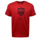 The RC Toulon Evergreen Tee by Nike is a red shirt featuring the Toulon RCT logo in black with a small black Nike swoosh beneath it. Made from pure cotton, this tee offers ultimate comfort and style.