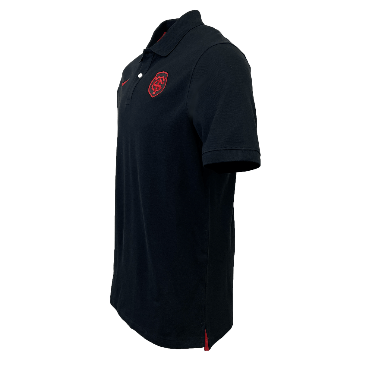Just In: Side view of the Stade Toulousain Pique Polo by Nike, featuring a black design with a red emblem on the left chest and red accents on the sleeves and bottom side seams.