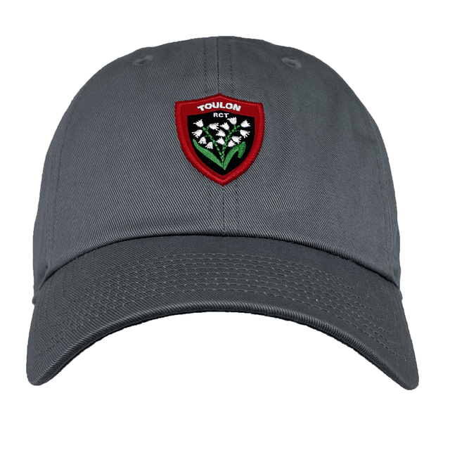 A grey RC Toulon Heritage 86 Cap by Nike, featuring a red and green badge adorned with white flowers and the text "TOULON RCT" on the front, perfect for Rugby Club Toulonnais fans.