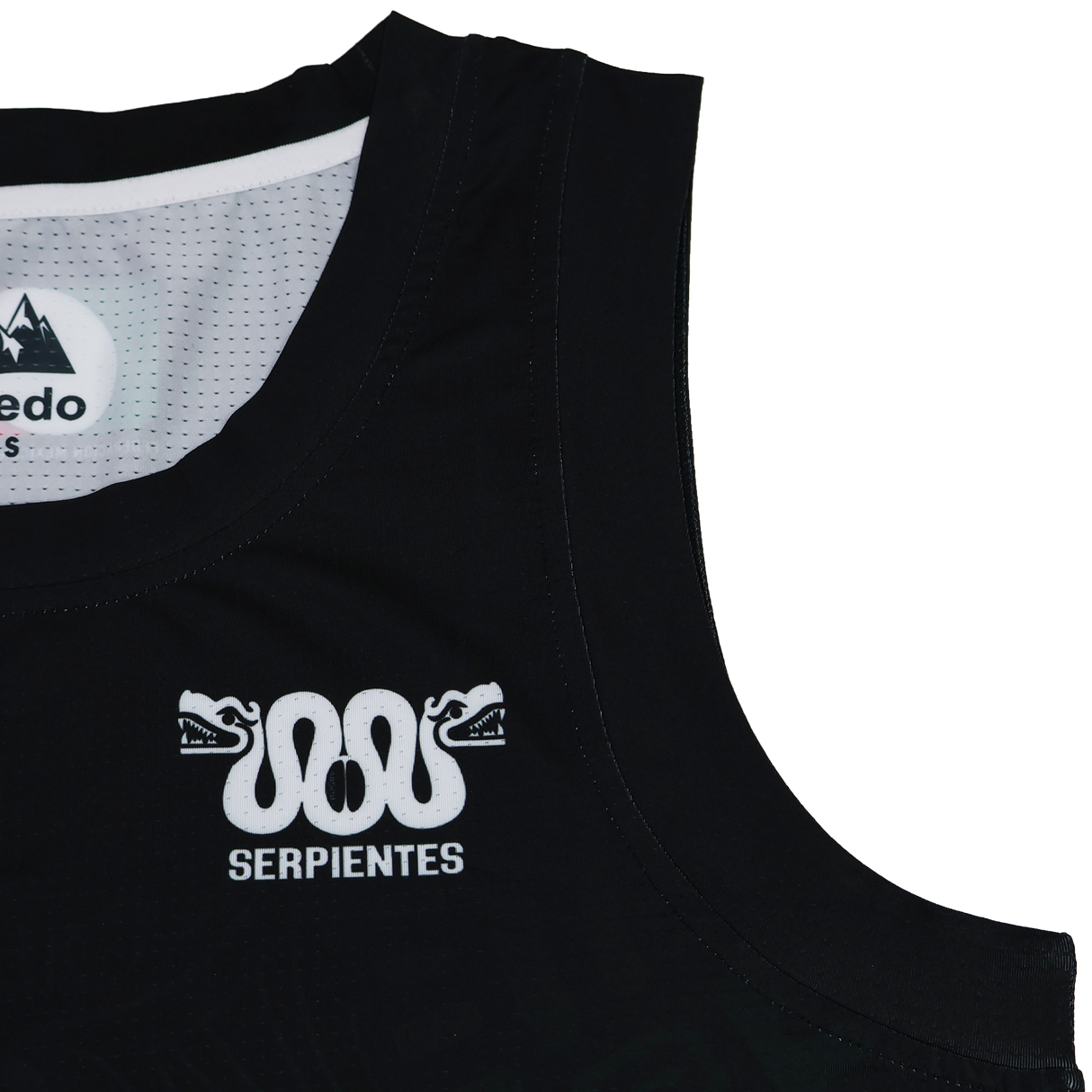 Close-up of the Las Serpientes Mexico Rugby Tank Top by Credo Rugby, black with a white two-snake-head logo and "SERPIENTES" printed below it on the left chest.