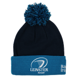 The Leinster Bobble Beanie 24/25 by Castore is a navy and blue hat with a pom-pom, embroidered crest, and text on the folded brim—an official accessory for true fans.