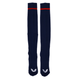 The USA Rugby 24/25 Home Socks by Castore are navy blue knee-highs with a red top stripe and white wing logos on the toes—ideal for Eagles fans, shown on a plain background.