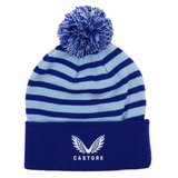 The Leinster Club Bobble Beanie 24/25 by Castore features blue and light blue stripes, a pom-pom on top, and an embroidered winged Castore logo on the folded brim.