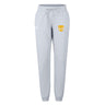 The Tacoma Tsunami Rugby Women's Leisure Sweatpant by EMB Canterbury features light gray fabric, a drawstring waist, and two front logos—a white logo on the left and a yellow and white "T" on the right—for everyday comfort.