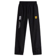 The Tacoma Tsunami Rugby Cuffed Hem Stadium Pant by EMB Canterbury features a black design, elastic waistband and cuffs, white "Canterbury of New Zealand" text on the left leg, and a yellow "T" logo on the right leg—perfect for men's rugby style.