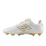 The New Balance Wide 442 Elite FG v3 in Sea Salt/Gold Metallic features gold accents, wide fit, and firm ground studs—ideal for players seeking stylish, comfortable performance on the field.