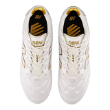 Top view of New Balance 442 Elite FG v3 soccer cleats in Sea Salt/Gold Metallic, featuring a microfiber upper with gold accents and logo details on the sides and insoles.