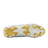 The image displays the sole of the New Balance Wide 442 Elite FG v3 soccer cleat in Sea Salt/Gold Metallic, featuring studded grips for firm ground traction.