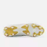 The sole of the New Balance 442 Elite FG v3 soccer cleat in Sea Salt/Gold Metallic, featuring gold and white studs, viewed from the bottom.