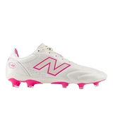 The New Balance Wide 442 Elite FG v3 soccer cleats in Sea Salt/Pink Heat feature pink accents and are designed for standout performance on firm ground.