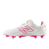 The New Balance 442 Elite FG v3 soccer cleat in Sea Salt/Pink Heat features a white premium leather upper with pink accents, including the "N" logo, studs, and heel tab—shown here in a side profile view.