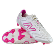 A pair of New Balance 442 Elite FG v3 soccer cleats in Sea Salt/Pink Heat, featuring pink accents and studs with the New Balance logo, displayed on a white background.