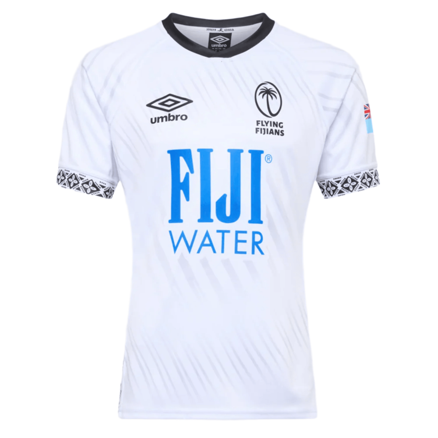 The Fiji 25/26 Replica Home Jersey by Umbro features white fabric with black masi art, Umbro and Flying Fijians logos, a blue FIJI Water sponsor, and a small Fijian flag on the sleeve.