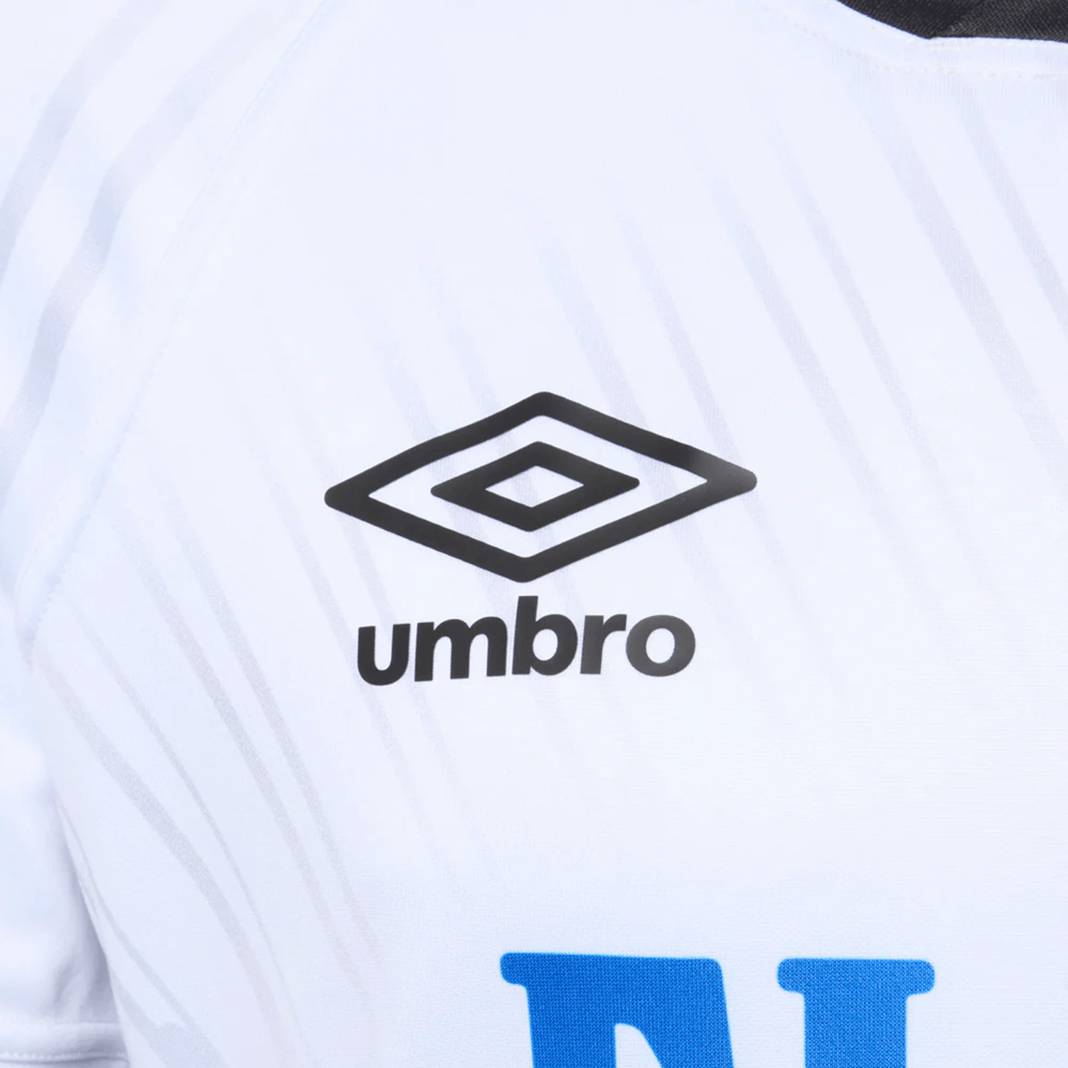 Close-up of the Fiji 25/26 Replica Home Jersey by Umbro, showcasing the black Umbro logo, detailed Fijian Masi Art designs, and partial blue text below.