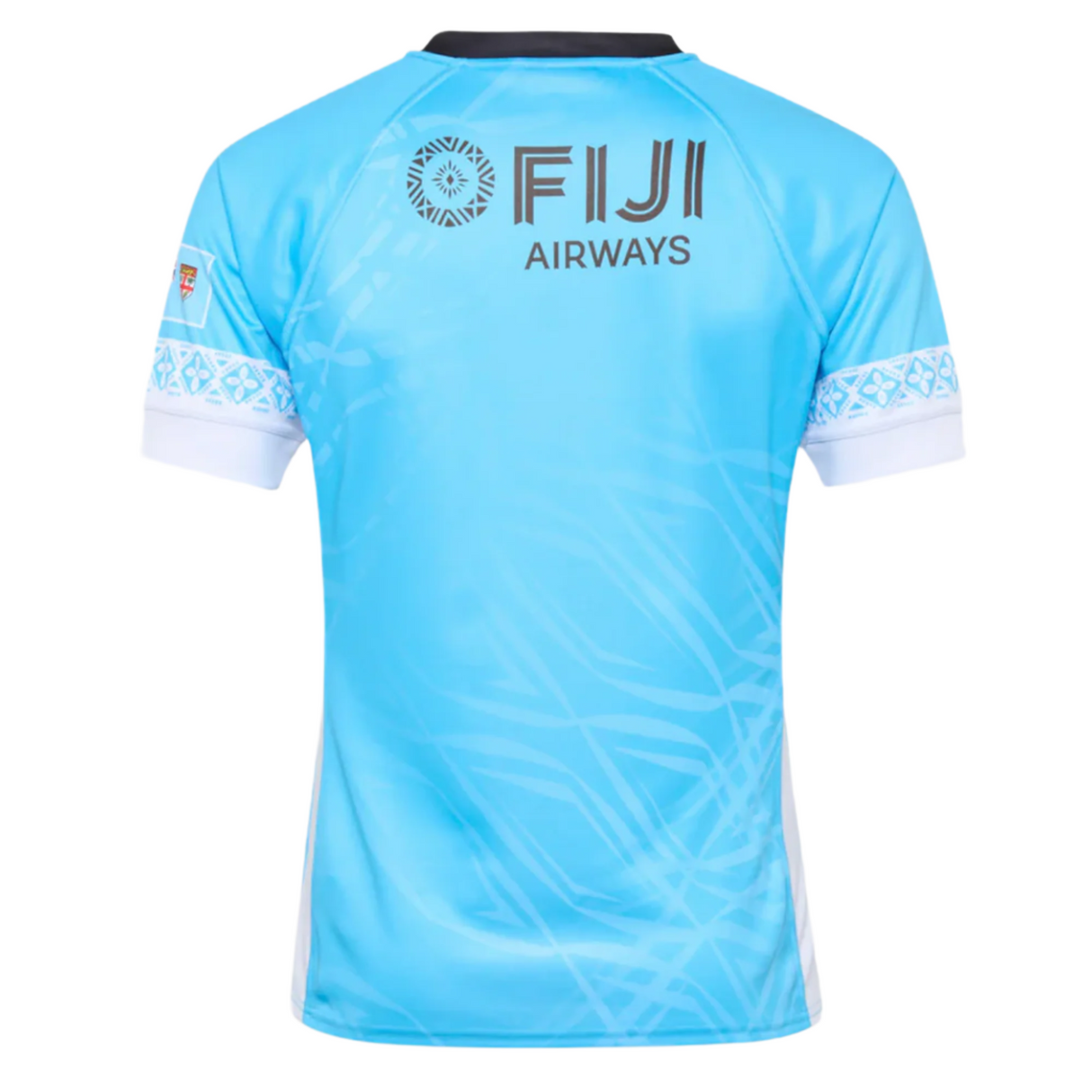 The Umbro Fiji 25/26 Replica Away Jersey is light blue with white and black trim, features “FIJI AIRWAYS,” a circular logo, Fijian masi art on the back, has an athletic polyester fit, and is displayed against a plain background.