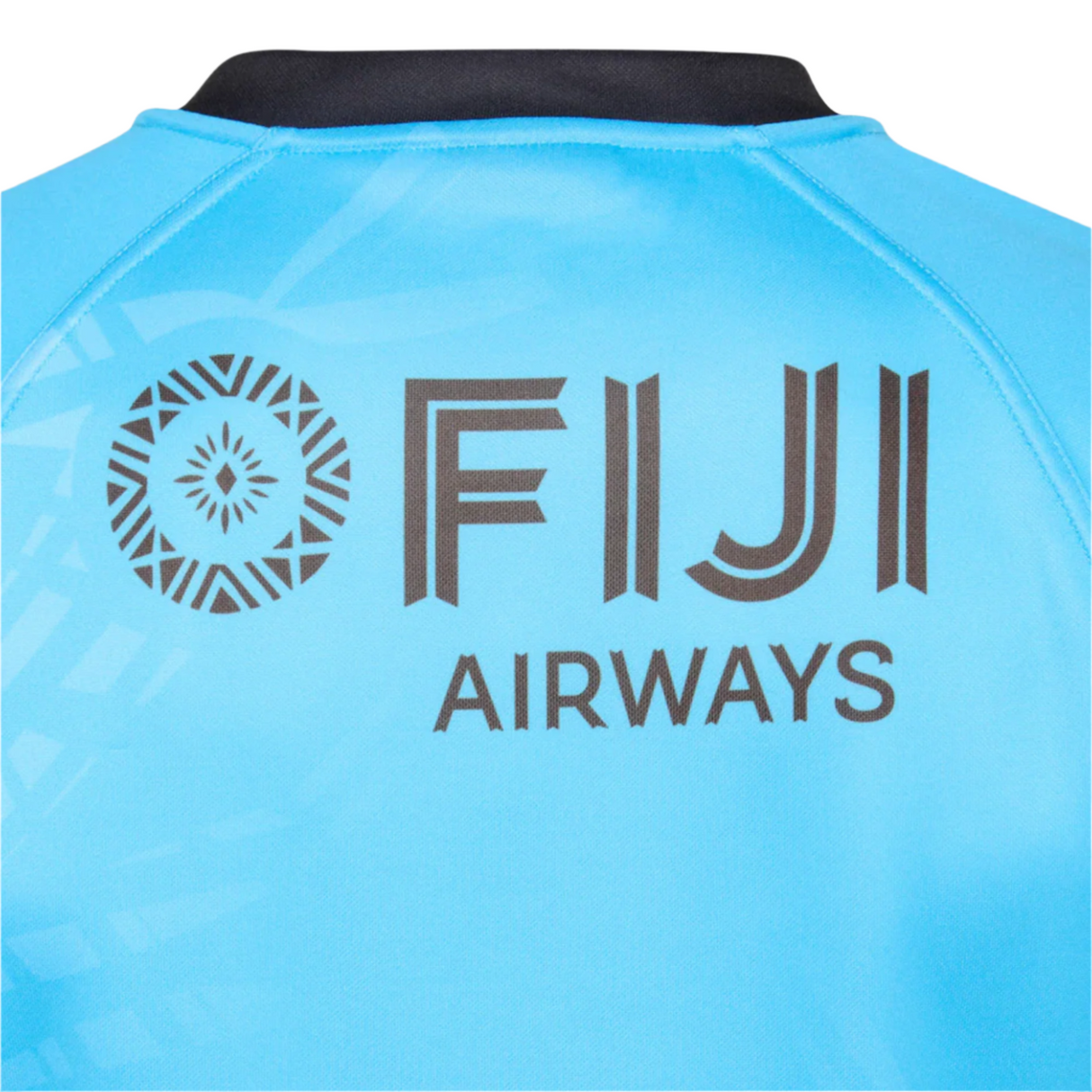 Back of the blue Fiji 25/26 Replica Away Jersey by Umbro featuring a black "FIJI AIRWAYS" logo and a circular geometric motif inspired by Fijian masi art on the left.