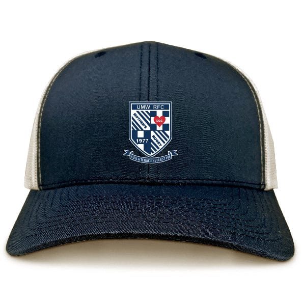 The University of Mary Washington Retro Trucker Cap by EMB Alpha Broder is a dark blue and white cap with a crest logo on the front that reads "UMW RFC" and "1977," featuring the text "Dula Tacta Dura Vita" along with an embroidered design. It comes complete with a snapback closure for adjustable fit.