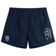 The University of Mary Washington Tactic Short by Canterbury, a pair of navy blue men's lightweight shorts from EMB Canterbury, features a logo on the left leg and a crest with a shield on the right leg. Ideal for rugby training sessions, these shorts are showcased against a plain white background.