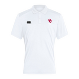 The EMB Canterbury University of Oklahoma Women Club Dry Polo showcases the Canterbury logo on the left and a red "OU" emblem on the right. Made with breathable Vapodri Technology, it offers both comfort and style, making it an ideal wardrobe addition.