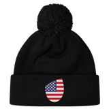 Explore EMB Canterbury's Just In collection featuring the USA Shield Pom Pom Beanie, a black knit hat with a playful pom-pom on top and a patch displaying the USA Shield. Stay warm, stylish, and patriotic.