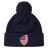 Just In: EMB Canterbury's USA Shield Pom Pom Beanie in navy blue, showcasing a cozy knit design with a playful pom-pom on top and featuring the USA Shield patch on the cuff.